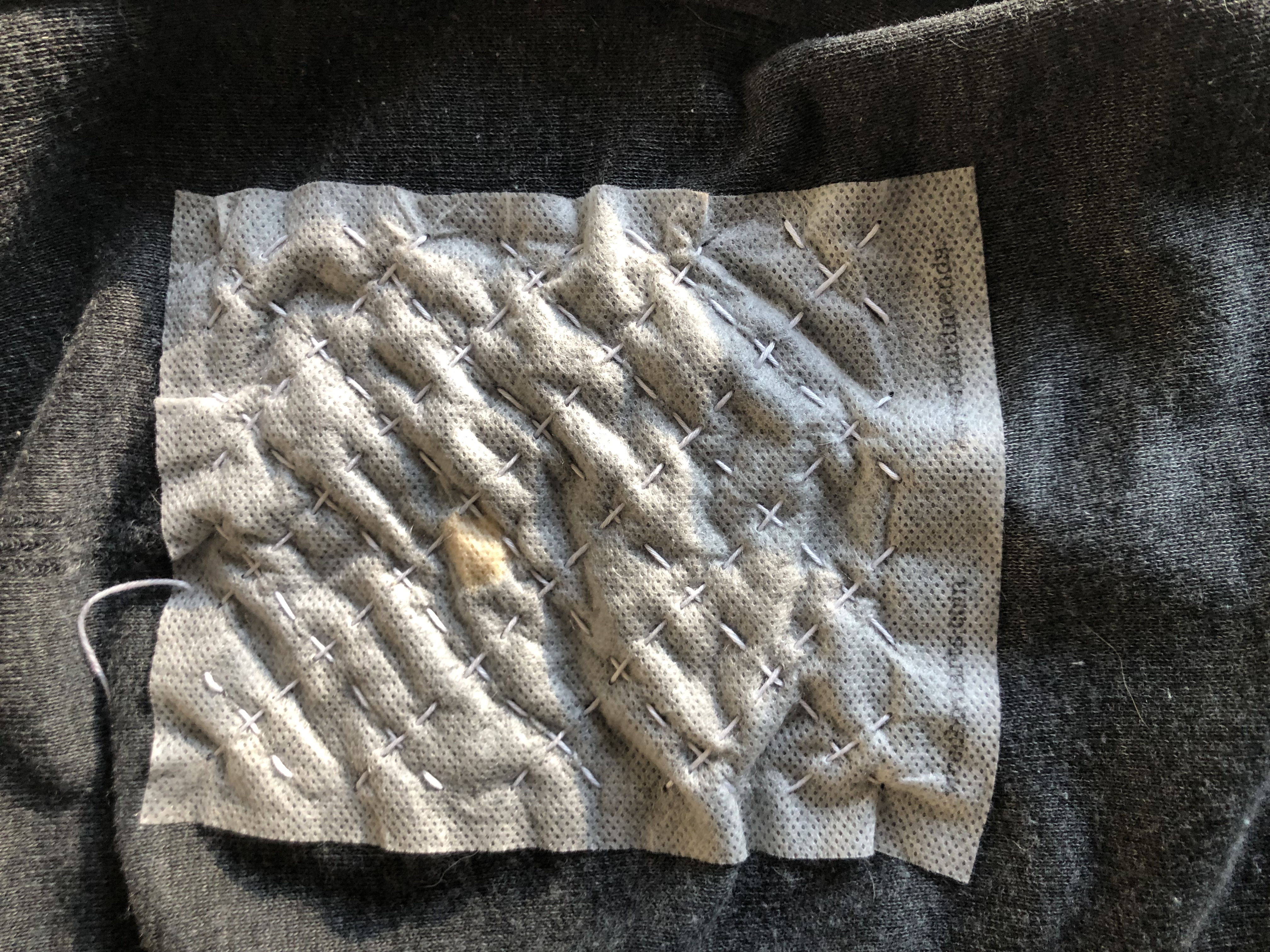 Mending hole on pants with washable Sashiko pattern from Wren Bird Arts